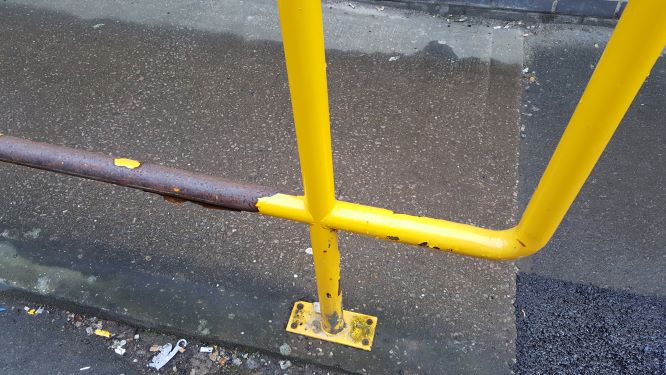 Failure of powder coated hand rails due to mechanical damage.